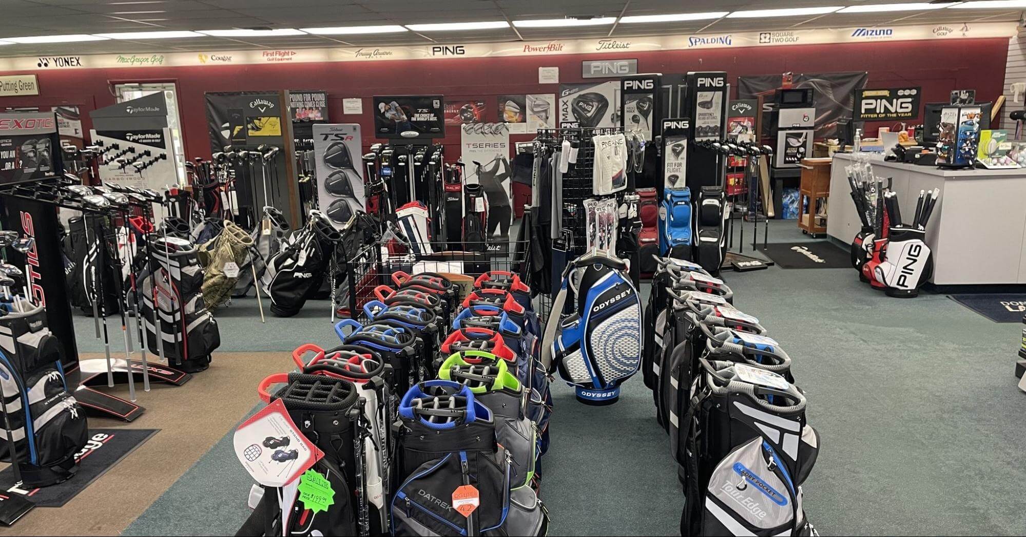 an inside shot of Bunker Run Golf showing golf bags and clubs lined up in the store