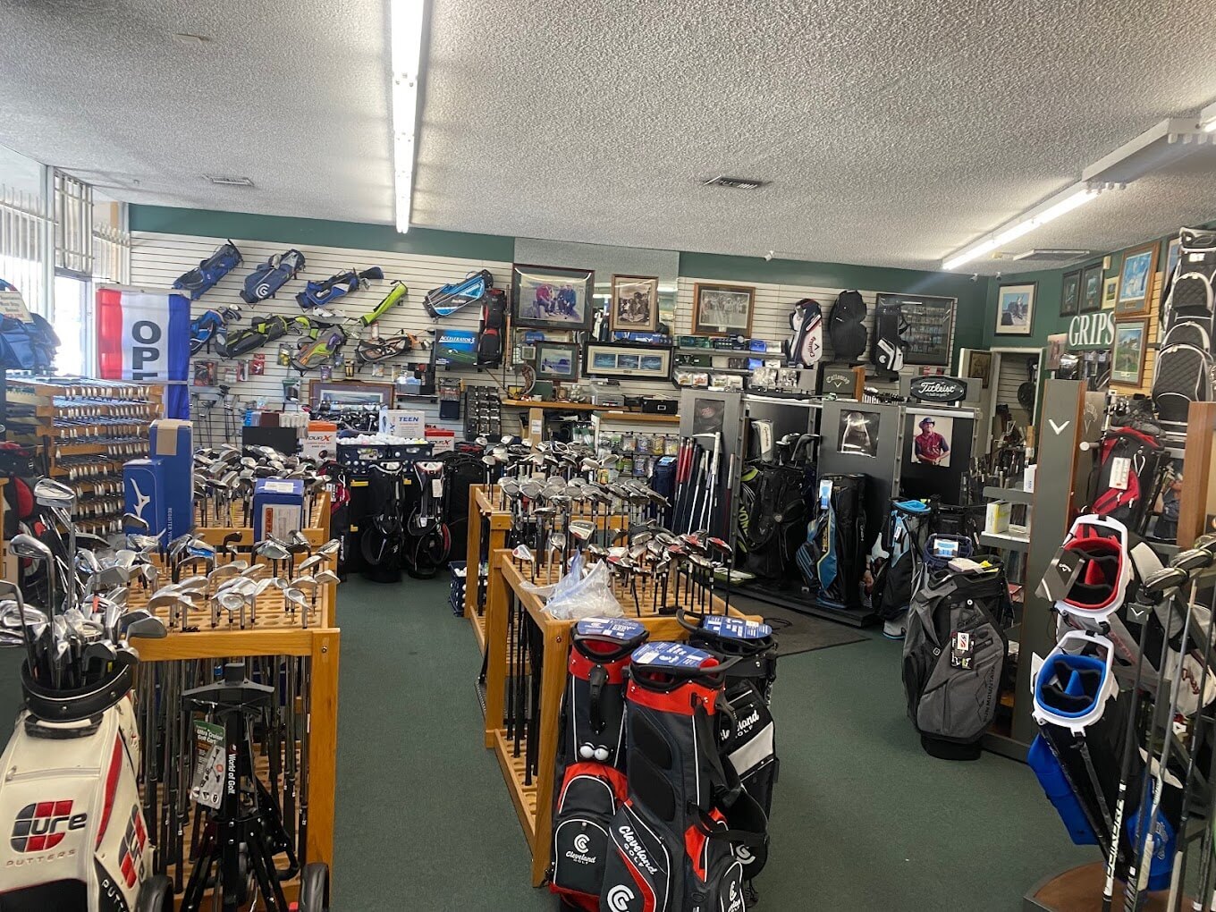 a view of the inside of Eaton's Golf Shop.  it's packed with golf clubs & equipment