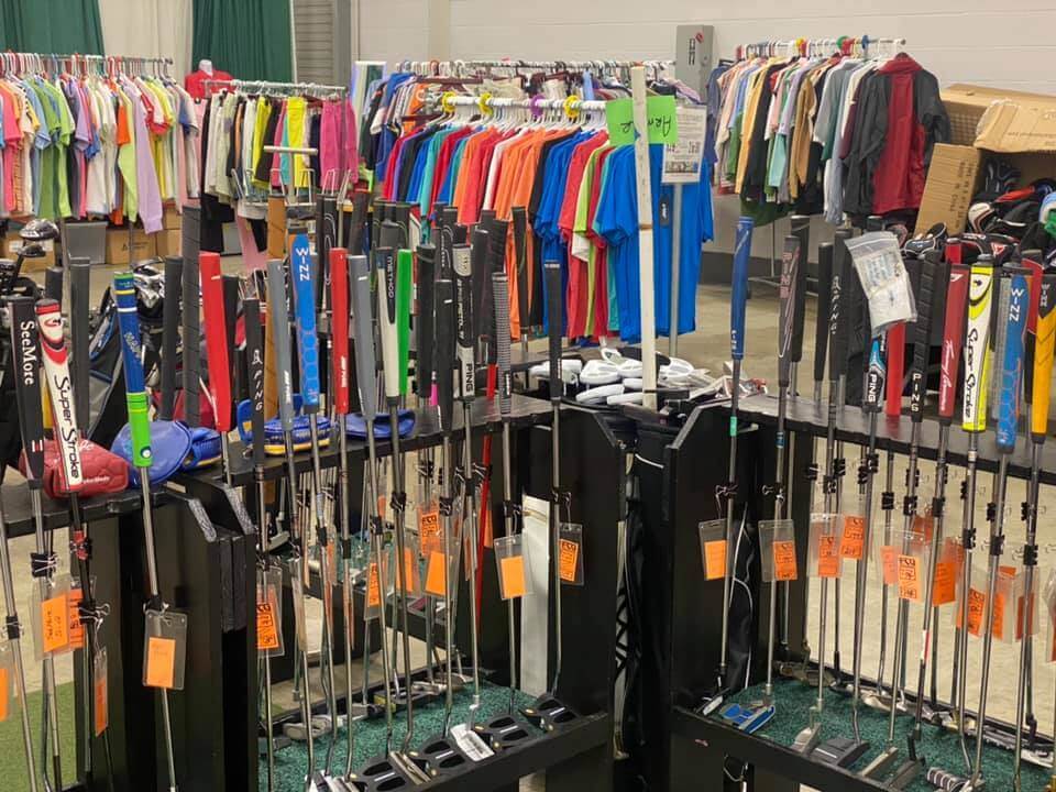 the inside of Fairway custom golf's shop depicting clubs and also golf apparel
