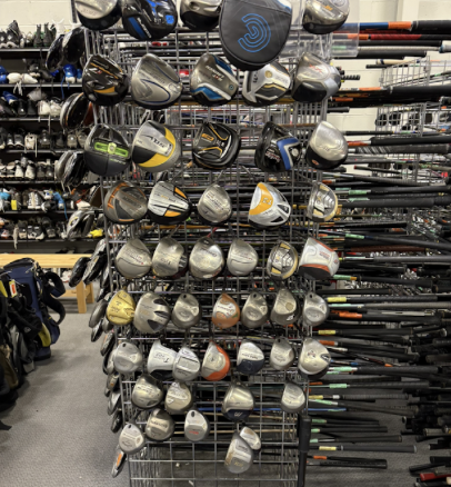 Racks of used golf clubs at Cincinnati's Play It Again Sports location