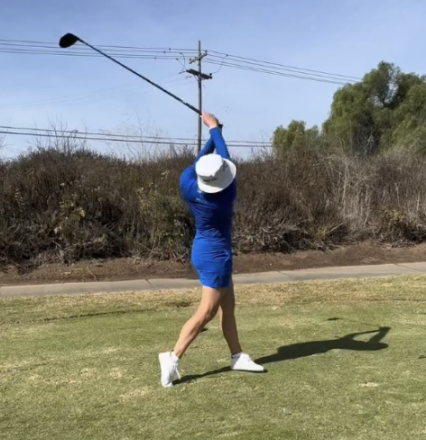 golfer taking a swing on the Orlando green