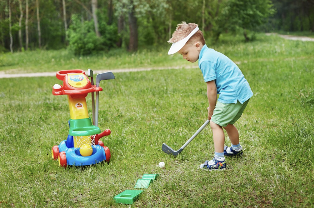 toddler learning to golf on fisher price golf toys
