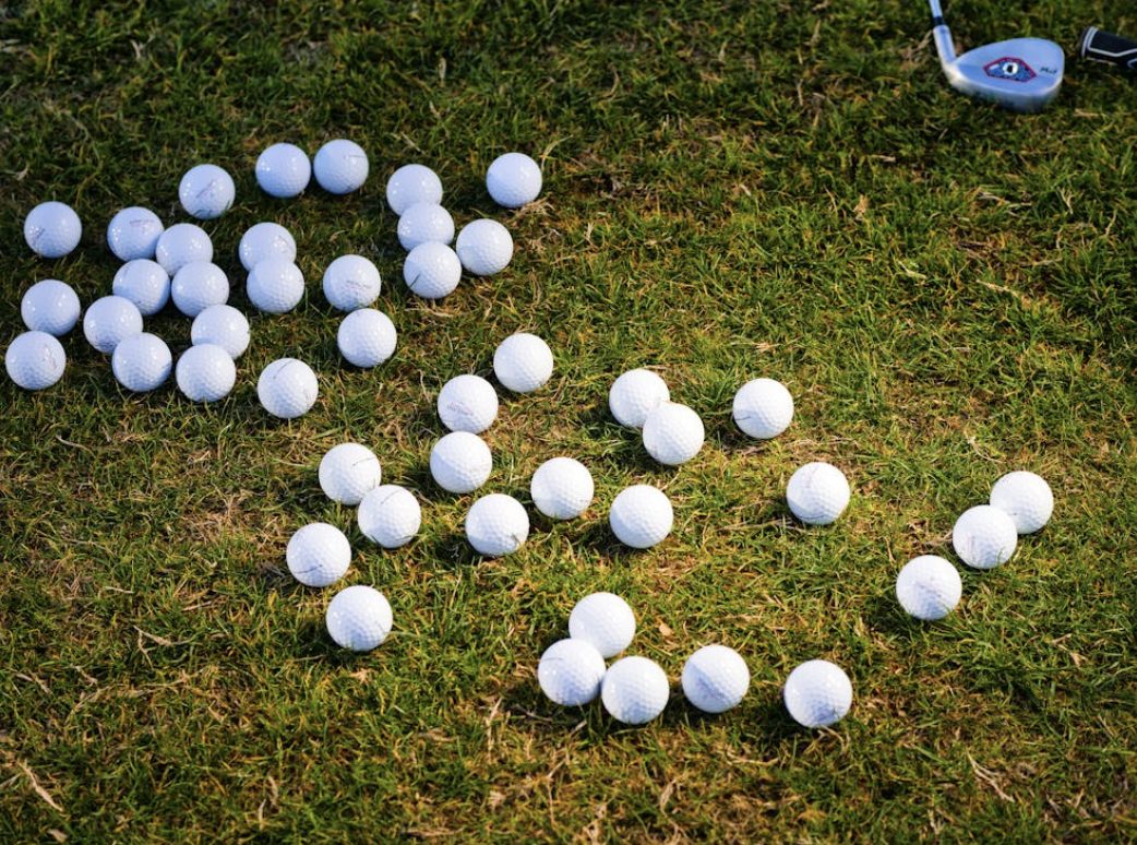 golf balls scattered on the green